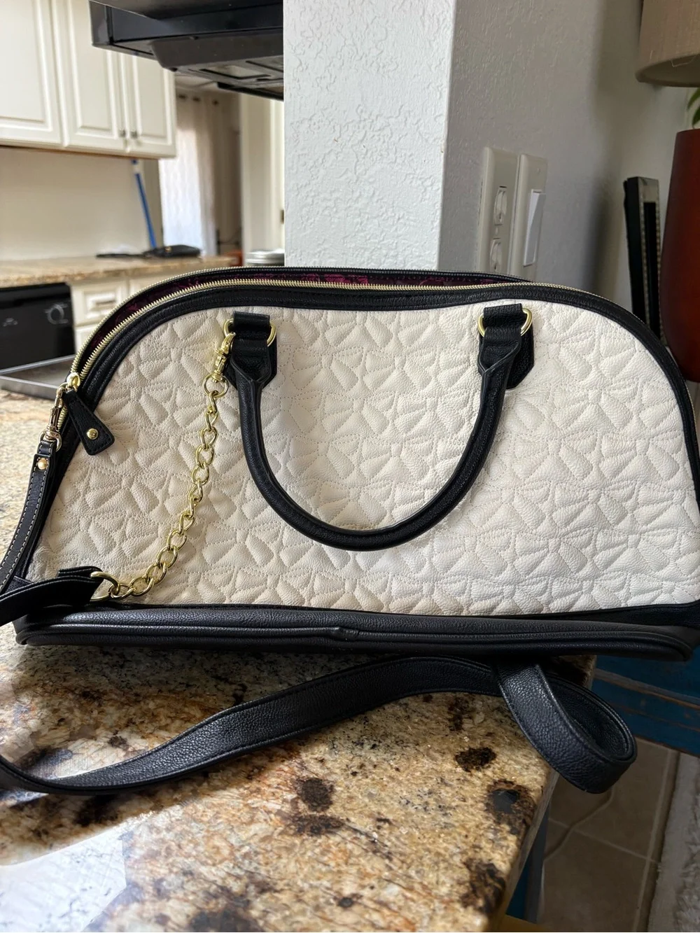 Betsey Johnson | Quilted bow hobo bag with flamingo wristlet.